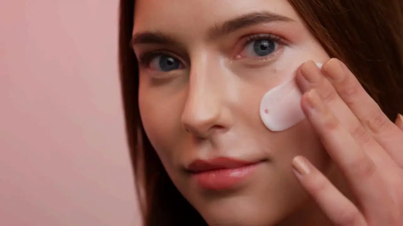Woman applying skincare